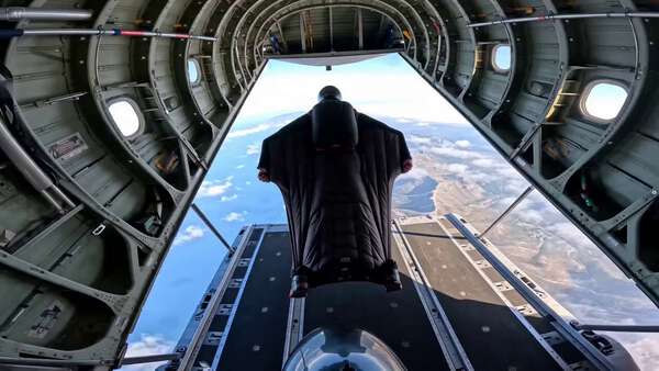 POV Skydiving Over Coastal Landscape